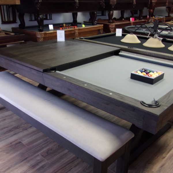 Beck's Billiard offers a 8' Presidential Billiards Kariba multi-purpose dining room pool table, with modern appeal. Enjoy the stunning dark finish and light grey felt, with long, padded bench seating with enough room to accommodate 10-12 people.